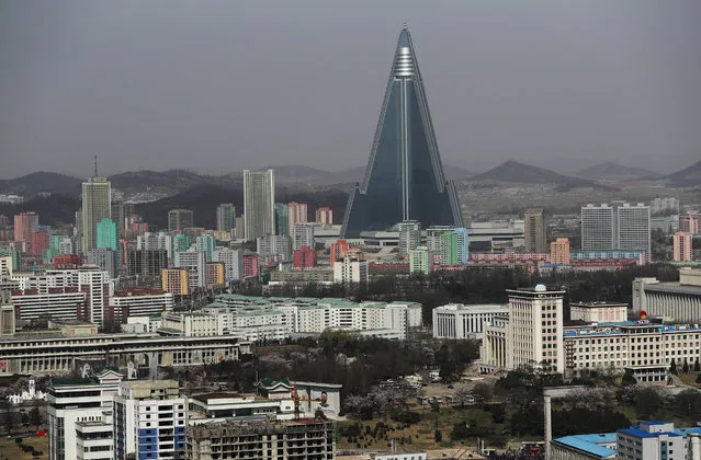 A general view of the the city with the Ryugyong Hotel at the back ground in Pyongyang, North Korea, 12 April 2017. North Koreas prepare to celebrate the “Day of the Sun Festival”, 105th birthday anniversary of former North Korean supreme leader Kim Il-sung in Pyongyang on 15 April. (Photo by How Hwee Young/EPA)