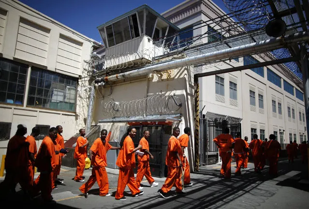 Inmates walk in San Quentin state prison in San Quentin, California, June 8, 2012. (Photo by Lucy Nicholson/Reuters)