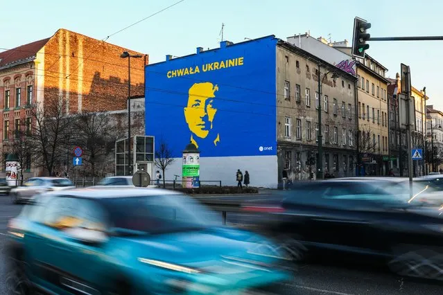A mural depicting Ukrainian president Volodymyr Zelenskyy and “Glory to Ukraine” slogan written in Polish is seen in Krakow, Poland on 22 March, 2022. (Photo by Beata Zawrzel/NurPhoto via Getty Images)