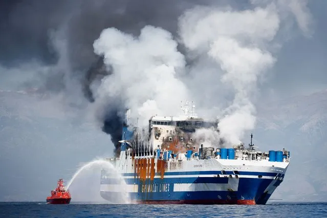 Smoke rises from the Italian-flagged Euroferry Olympia, which sailed from Greece to Italy early on Friday and caught fire, off the coast of Corfu, Greece, February 19, 2022. (Photo by Guglielmo Mangiapane/Reuters)