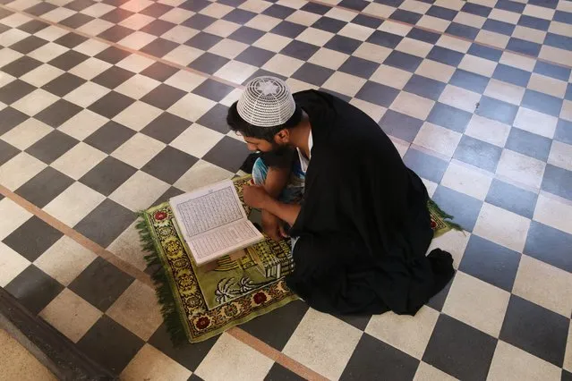 Indian Muslim read from The Quran (Islamic Holy Book) as they sit inside a Mosque in Kolkata on April 10,2022. (Photo by Debajyoti Chakraborty/NurPhoto via Getty Images)