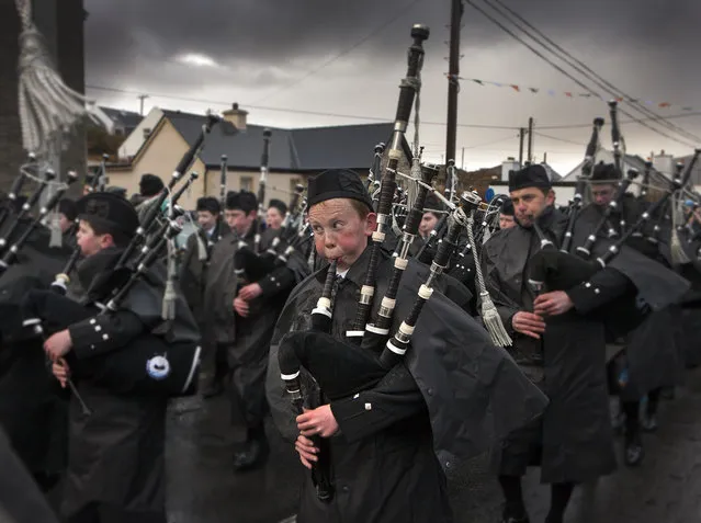 “Saint Patricks Day”. Clew Bay Pipe Band Piper playing at the Achill Island, Ireland Saint Patrick's Day Parade. Photo location: Achill Island, County Mayo, Ireland. (Photo and caption by Glen McClure/National Geographic Photo Contest)