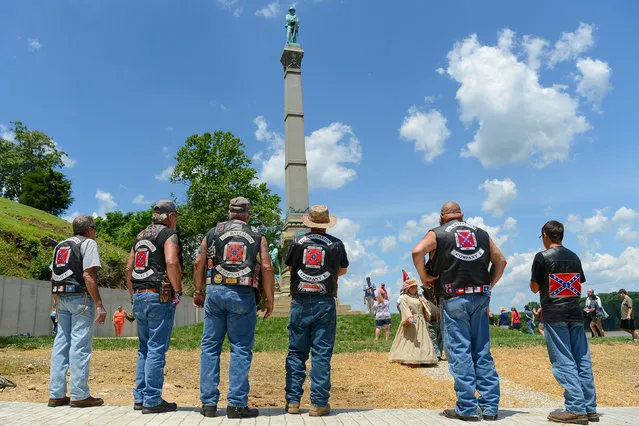 Members from The Sons of Confederate Veterans stand before a dedication ceremony in Brandenburg, Kentucky, U.S. May 29, 2017 for a Civil War Confederate Soldier Memorial recently removed from the campus of the University of Louisville. (Photo by Bryan Woolston/Reuters)