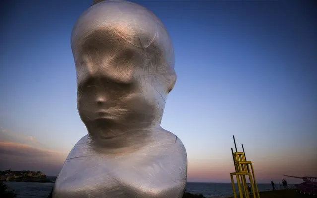 A sculpture by Slovakian artist Viktor Freso titled “Angry Boy” is wrapped in plastic on the eve of the launch of Sculpture By The Sea at Bondi Beach on October 23, 2019 in Sydney, Australia. (Photo by David Gray/Getty Images)