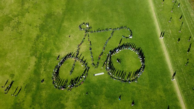 A diverse group of bike collective members joined forces to create a monumental bike using their own bicycles in Bogota, Colombia on June 4, 2023. Bogota is a city of around eight million people, but with cycle paths covering more than 360km (more than 220 miles) of the cityâs surface itâs never been easier for its citizens to make their own way around the city. Almost 84,000 people use Bogotaâs cycle route network every day, cutting their costs and reducing pollution at the same time. (Photo by Juancho Torres/Anadolu Agency via Getty Images)