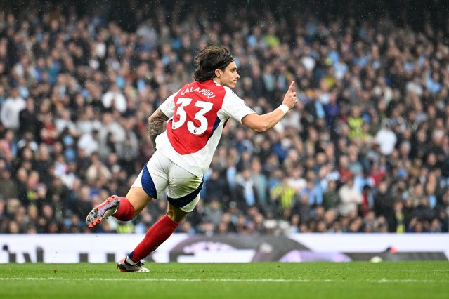 Riccardo Calafiori of Arsenal celebrates scoring his team's first goal during the Premier League match between Manchester City FC and Arsenal FC at Etihad Stadium on September 22, 2024 in Manchester, England. (Photo by David Price/Arsenal FC via Getty Images)