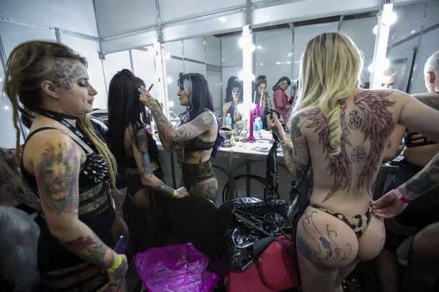 Women prepare for the runway of the Miss Tattoo Brazil during the Tattoo Week, the largest convention of art in the skin of Latin America, in Sao Paulo, Brazil, 14 July 2017. The election of the most beautiful tattooed woman in Brazil, the new tendencies and techniques of the tattoo world, the bodypiercing and the environment of the always controversial art of definitively painting the body, marked today the beginning of the seventh edition of the “Tattoo Week Sao Paulo”. (Photo by Sebastiao Moreira/EFE via ZUMA Press)