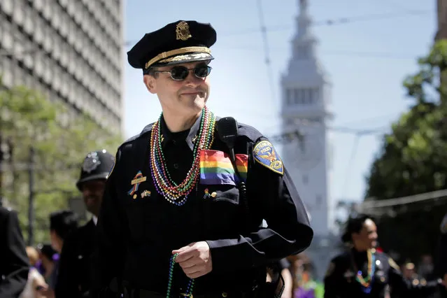 A San Francisco Police officer marches in the San Francisco LGBT Pride Parade in San Francisco, California, U.S. June 26, 2016. (Photo by Elijah Nouvelage/Reuters)