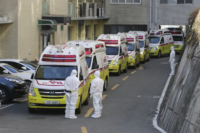 Ambulances carrying patients infected with the novel coronavirus arrive at a hospital in Daegu, South Korea, Sunday, February 23, 2020. (Photo by Lim Hwa-young/Yonhap via AP Photo)