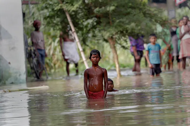 People wait to be rescued from a flooded village in the eastern state of Bihar, India August 22, 2017. (Photo by Cathal McNaughton/Reuters)