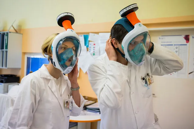 Medical workers wear snorkel masks transformed into high-grade protection at Czech Technical University in Prague, Czech Republic on March 30, 2020. (Photo by Fn Motol/Reuters