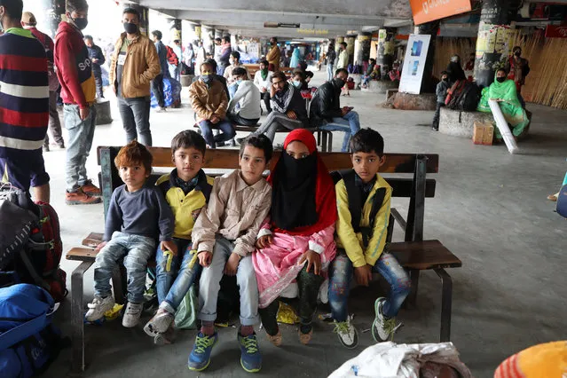 Stranded passengers wait for transportation at the general bus stand during a lockdown in Jammu, India, 25 March 2020. Prime Minister of India Narendra Modi declared a 21-day lockdown across India, which started on 24 March, in a bid to slow down the spread of the ongoing pandemic of the COVID-19 disease caused by the SARS-CoV-2 coronavirus. According to health authorities, India has 519 confirmed cases of COVID-19. (Photo by Jaipal Singh/EPA/EFE)