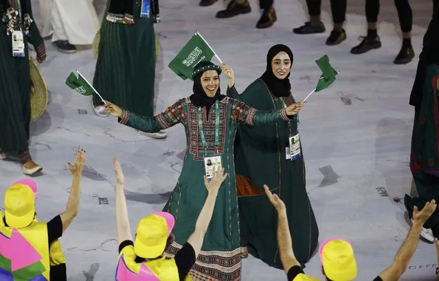 2016 Rio Olympics, Opening ceremony, Maracana, Rio de Janeiro, Brazil on August 5, 2016. Sarah Attar (KSA) of Saudi Arabia waves flags during the opening ceremony. (Photo by Stoyan Nenov/Reuters)