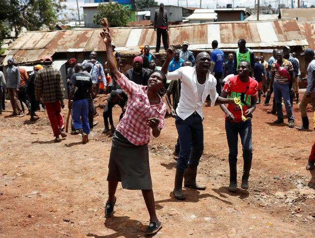 Opposition supporters throw stones at police in Kibera slum in Nairobi, Kenya on October 26, 2017. (Photo by Goran Tomasevic/Reuters)