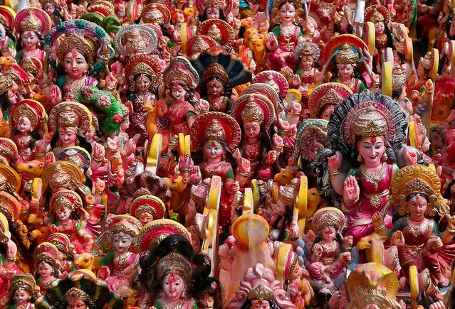 Idols of Hindu Goddess Dashama, left by devotees, are pictured on the banks of river Sabarmati, a day after the “Dashama” festival in Ahmedabad, India, August 12, 2016. (Photo by Amit Dave/Reuters)