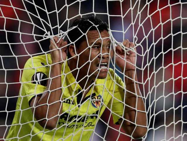 Villarreal' s Colombian forward Carlos Bacca ends up in the back of the net during the UEFA Europa League group A football match Slavia Prague v Villarreal in Prague on November 2, 2017. (Photo by David W. Cerny/Reuters)