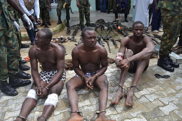 Suspected members of the Niger Delta Avengers are seen as they are paraded by the Nigeria military after their arrest in the Nembe waters, Rivers, Nigeria, August 22, 2016. (Photo by Reuters/Stringer)