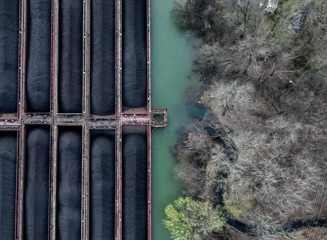 A drone view shows coal prepared for transport, along the Kanawha river outside of Charleston, West Virginia on March 24, 2025. (Photo by Evelyn Hockstein/Reuters)