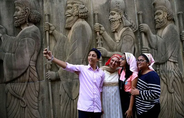 An Indian Parsi family takes a selfie at a fire temple, on occasion of Parsi New Year, in Mumbai, India, Wednesday, August 17, 2016. Parsis, also known as Zoroastrians, worship fire and are followers of the bronze age Persian prophet, Zoroaster. (Photo by Rafiq Maqbool/AP Photo)