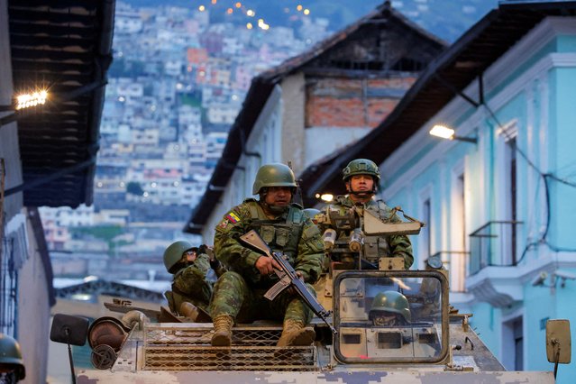 Soldiers in an armoured vehicle patrol the city's historic centre following an outbreak of violence a day after Ecuador's President Daniel Noboa declared a 60-day state of emergency following the disappearance of Adolfo Macias, leader of the Los Choneros criminal gang, from the prison where he was serving a 34-year sentence, in Quito, Ecuador on January 9, 2024. (Photo by Karen Toro/Reuters)