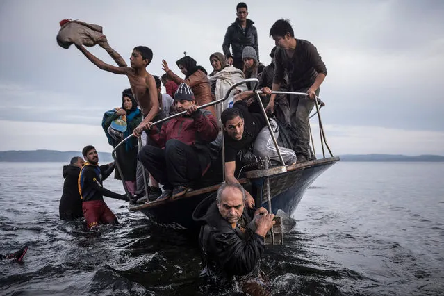 “Exodus” by Sergey Ponomarev. This project explores the life of migrants and refugees of the Middle East and Africa. People arrive on the island of Lesbos by Turkish boat. The owner of the boat delivered 150 people to the Greek coast and was later arrested. (Photo by Sergey Ponomarev/Getty Images)