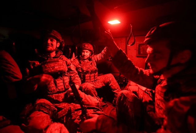 Servicemen of the 49th Separate Assault Battalion Carpathian Sich of the Armed Forces of Ukraine ride a Mine Resistant Ambush Protected (MRAP) vehicle after the combat mission, amid Russia's attack on Ukraine, near the town of Toretsk in Donetsk region, Ukraine on April 8, 2025. (Photo by Anatolii Stepanov/Reuters)