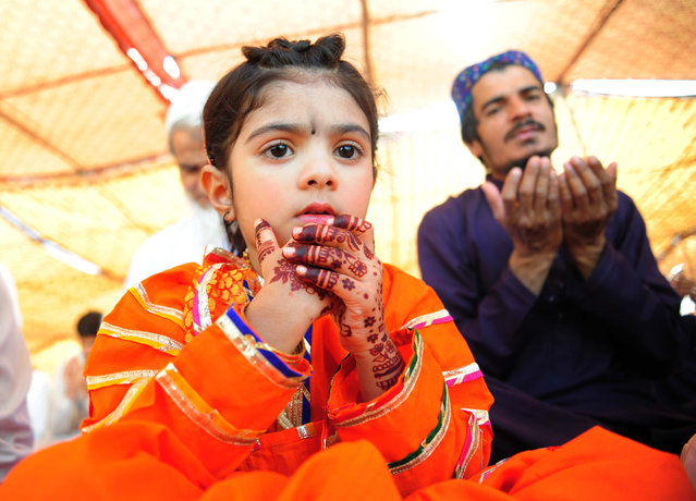 Pakistani Muslims attend an Eid Al-Fitr prayer service, in Hyderabad, Pakistan, 31 March 2025. Muslims around the world have begun celebrating Eid al-Fitr, the three-day festival which marks the end of the fasting month of Ramadan. During Eid al-Fitr, most people travel to visit each other in town or outside of it and children receive new clothes and money to spend for the occasion. (Photo by Nadeem Khawer/EPA/EFE)