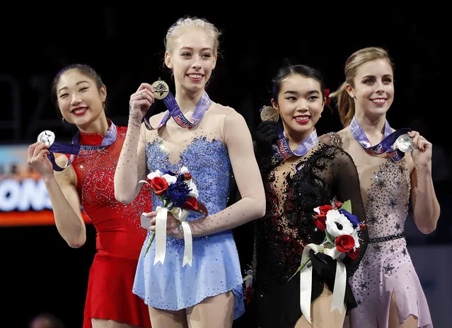 Bradie Tennell, foreground, poses after winning the women's free skate event with second place finisher Mirai Nagasu, left, third place finisher Karen Chen, second from right, and fourth place finisher Ashley Wagner at the U.S. Figure Skating Championships in San Jose, Calif., Friday, January 5, 2018. (Photo by Tony Avelar/AP Photo)