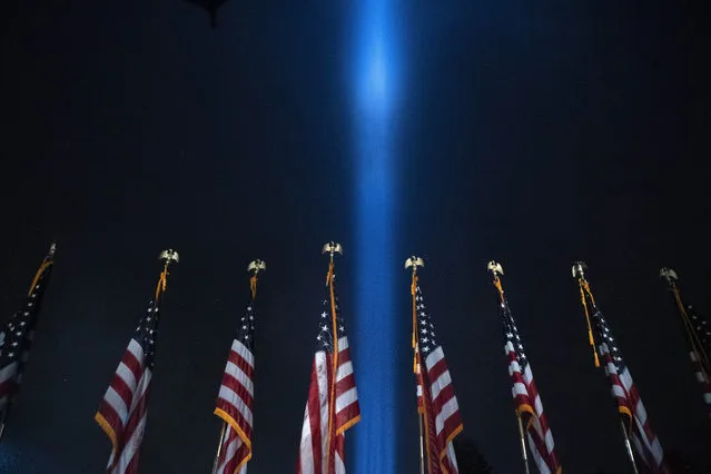 A beam of light is seen over the Pentagon, as part of the Towers of Light Tribute marking the 19th anniversary of the 9/11 attack on the Pentagon, Wednesday, September 9, 2020, in Washington. (Photo by Jose Luis Magana/AP Photo)