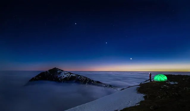 The winning entry by Anglesey bookkeeper Kat Lawman is an image shot above the clouds at the top of Garnedd Ugain in Eryri (Snowdonia), that shows Jupiter, Saturn and Venus aligning under the watchful gaze of a wild camper. Kat, who also spends her time as a mountain leader and took up photography as a hobby three years ago, said: “It was such a truly earth-moving moment I was reduced to tears. The mountains here in Snowdonia are my life, and my escape … This night in December I managed to get the whole Snowdon massif all to myself, there wasn’t another single person around and this photo will always be the most special one to me”. (Photo by Kat Lawman/Mountain Photo of the Year)