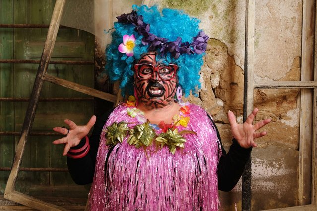 A carnival participant poses for a picture in costume during the Zambo carnival held in the northern Lebanese city of Tripoli on March 17, 2024, to mark the last period of excess on the eve of the Christian Greek Orthodox lent. The inspiration of the annual Zambo celebration is unclear, despite it being a tradition that stretches back over a century to when an emigrant to Brazil returned to his native Tripoli bringing the carnival with him. (Photo by Ibrahim Chalhoub/AFP Photo)