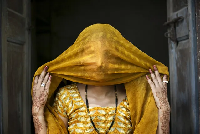 15 year old Priyanka (name changed) poses for a photo on August 2, 2016 in Uttar Pradesh, India. She was raped by a neighbor last year when she was 14 years old. The neighbor had been harassing her for a long time and then one night he came on motorcycles with friends and threatened to kill her if she didn't get on the bike with him. He took her to a friend's house and raped her. For 10 days the police refused to register a case against him and when they did, they held her for two days in the station until she agreed to say in the statement that she went willingly with the him. Priyaka and her family say that he comes from a rich, influential family. The people in her village gossip, they say that she ran away willingly with him and that she did bad things. (Photo by Getty Images)