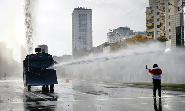 Police use a water cannon against demonstrators during a rally in Minsk, Belarus, Sunday, October 4, 2020. Hundreds of thousands of Belarusians have been protesting daily since the Aug. 9 presidential election. (Photo by AP Photo/Stringer)