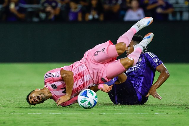 Orlando City defender Alex Freeman, right, slides into Inter Miami forward Luis Suárez (9) during the first half of an MLS soccer match Sunday, August 10, 2025, in Orlando, Fla. (Photo by Kevin Kolczynski/AP Photo)