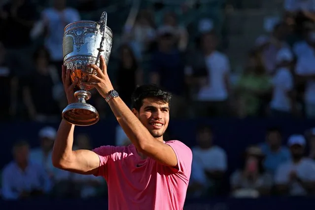 Spaniard Carlos Alcaraz celebrates with the trophy after winning the final of ATP 250 Argentina Open against British Cameron Norrie in Buenos Aires on February 19, 2023. (Photo by Luis Robayo/AFP Photo)