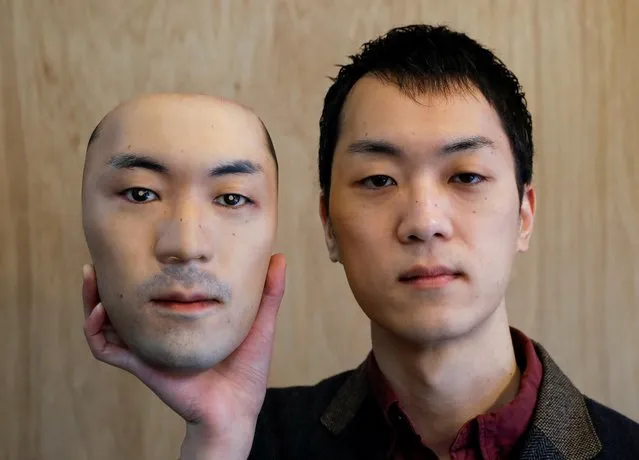 Shuhei Okawara, 30, owner of mask shop Kamenya Omote, holds a super-realistic face mask based on his real face, made by using 3D printing technology, in Tokyo, Japan on December 16, 2020. (Photo by Issei Kato/Reuters)