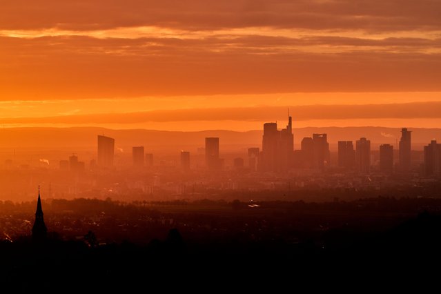 The buildings of the banking district are pictured during sunrise in Frankfurt, Germany, Tuesday, November 4, 2025. (Photo by Michael Probst/AP Photo)