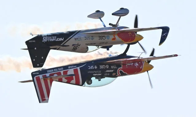 Matt Hall (top) and Emma McDonald of the Red Bull aerobatic team perform during the Australian International Airshow Aerospace and Defence Expo at Avalon Airport in Geelong on March 3, 2023. (Photo by Paul Crock/AFP Photo)
