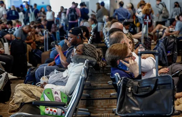 Delayed travelers wait for air traffic to resume at Ronald Reagan Washington National Airport ahead of the July 4th holiday weekend in Arlington, Virginia, U.S., June 30, 2023. (Photo by Evelyn Hockstein/Reuters)