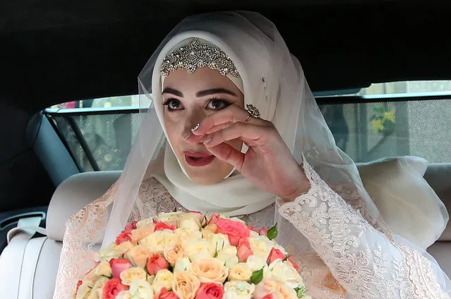 The bride in her car during a traditional Chechen wedding ceremony in Grozny, Chechnya, Russia on November 24, 2016. (Photo by Valery Sharifulin/TASS)