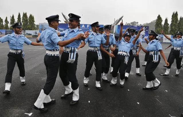 Newly recruited officers of Indian Air Force (IAF) celebrate their graduation during a ceremony in Bangalore, India, Friday, December 2, 2016. A total of forty officers, including nine women, joined the ranks of the IAF after seventy-four weeks of training. (Photo by Aijaz Rahi/AP Photo)