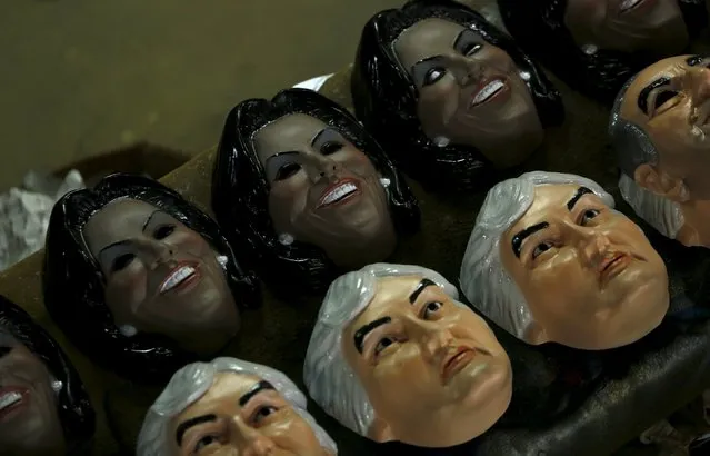 Carnival masks bearing the likeness of Brazil's Senator Delcidio Amaral and U.S. first lady Michelle Obama, are displayed at a costume factory in the suburb of Rio de Janeiro, Brazil, January 11, 2016. (Photo by Pilar Olivares/Reuters)