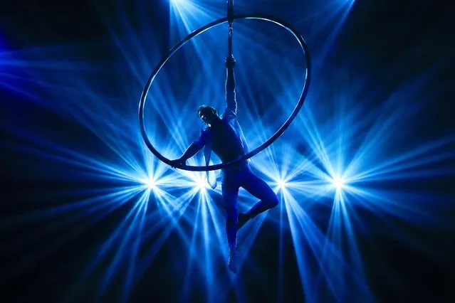 Jeka Dehtiarov performs the “Cyr Wheel Act” during the Swiss Dream Circus Performance in Damansara, outside Kuala Lumpur, Malaysia, 28 June 2023. The Swiss Dream Circus Performance will be held from 28 June to 23 July 2023. (Photo by Fazry Ismail/EPA)
