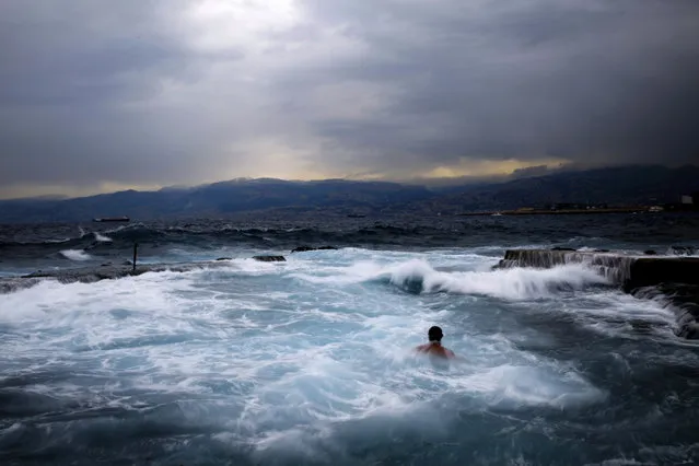 Men swimming during an early morning swim in the Mediterranean sea in cool temperatures of 8 degrees celsius, 46.4 Fahrenheit, across Beirut, Lebanon, Thursday, February 16, 2017. (Photo by Hassan Ammar/AP Photo)