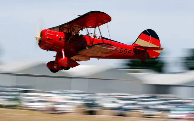 A biplane taking part in the Vintage Air Rally lands, in Stellenbosch, near Cape Town, South Africa December 16, 2016. (Photo by Mike Hutchings/Reuters)