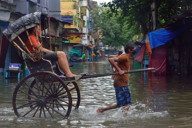 Heavy monsoon rains cause floods in several parts of Kolkata, West Bengal, India on June 17, 2021. (Photo by Sumit Sanyal/Anadolu Agency via Getty Images)