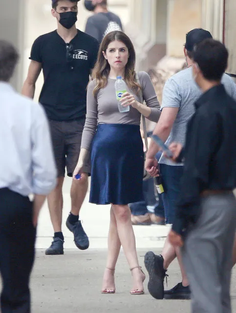 American actress Anna Kendrick and Charlie Carrick are spotted on the set of the new movie “Alice, Darling” in Toronto on July 19, 2021. Anna held a bag of food and a coffee while walking down the street with her co-star. The 35 year old American actress wore a beige top paired with a navy skirt and beige heels. (Photo by The Image Direct)