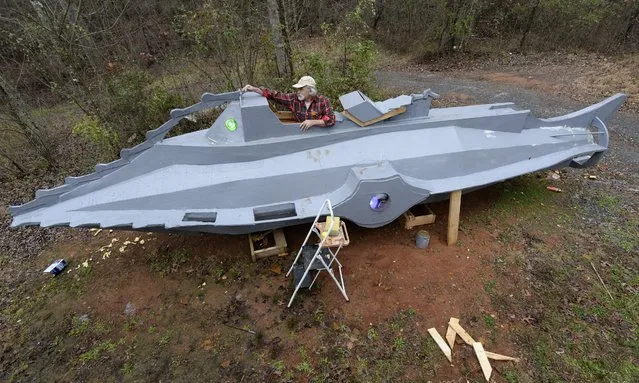 Danny McWilliams, 56, works on his 36-foot-long replica of Walt Disney movie version of the Nautilus submarine from Jules Verne's “20,000 Leagues Under the Sea” at his rural home in Ellijay, Georgia, USA, 04 December 2013. McWilliams, a disabled eccentric and long-time enthusiast of the Disney movie, plans on giving the non-seaworthy submarine to a museum in Florida. McWilliams has been working on the project for more than a year and nearly finished. (Photo by Erik S. Lesser/EPA)
