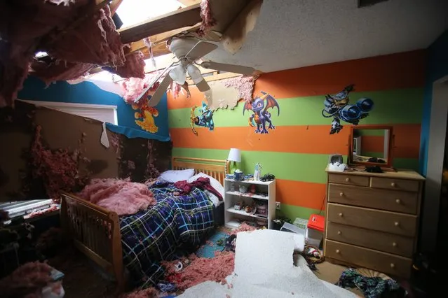A child's damaged room in the Price residence after tornados hit Pensacola, Florida, USA, 24 February 2016. Storms struck the south east region late on 23 February, killing 3 and damaging property in Mississippi, Louisiana and parts of Florida. (Photo by Dan Anderson/EPA)