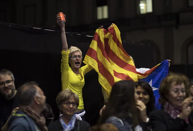 Supporters of Republican Left party of Catalonia celebrate the results of the general election in Barcelona, Spain, Sunday, April 28, 2019. Prime Minister Pedro Sánchez's party wins 129 seats and the far-left United We Can 33, still one dozen seats short of the 176 majority in Spain's Lower House. (Photo by Emilio Morenatti/AP Photo)